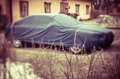 Waterproof car cover. (Tilt/shift lens used, cross processed and little grain added)
