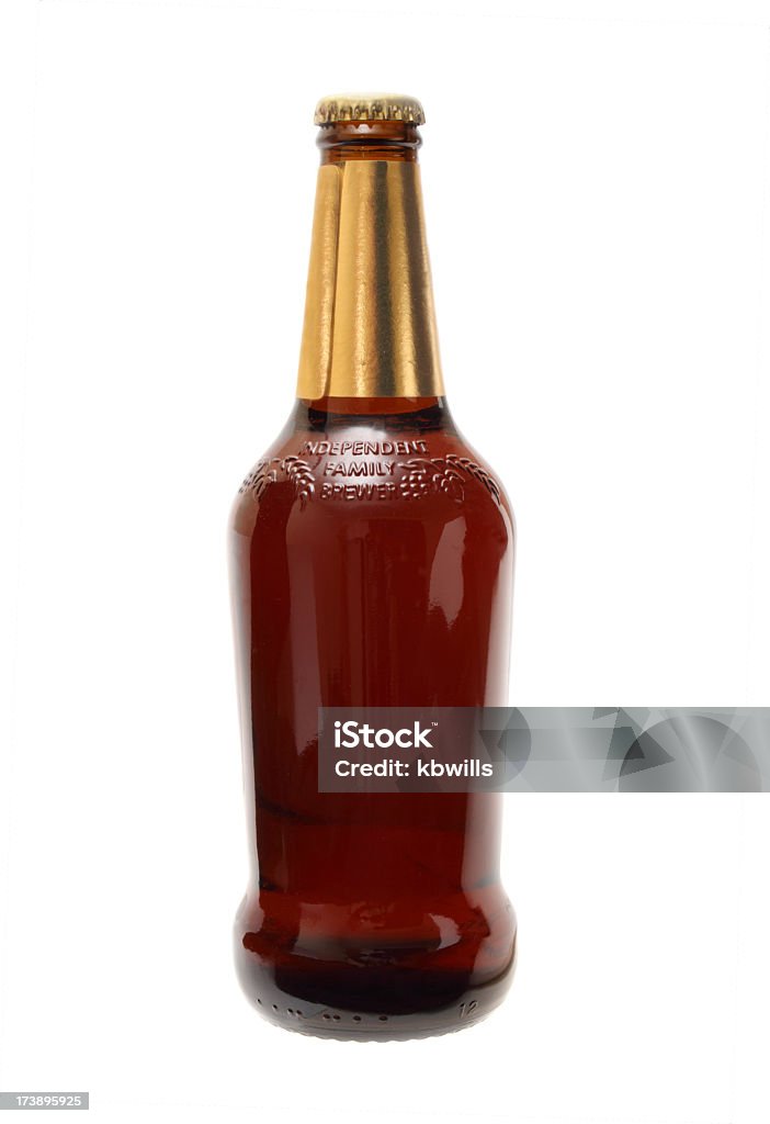 premium brand beer bottle a half litre beer bottle (dark british bitter) with an attractive golden collar - premium brand - isolated on white Alcohol - Drink Stock Photo