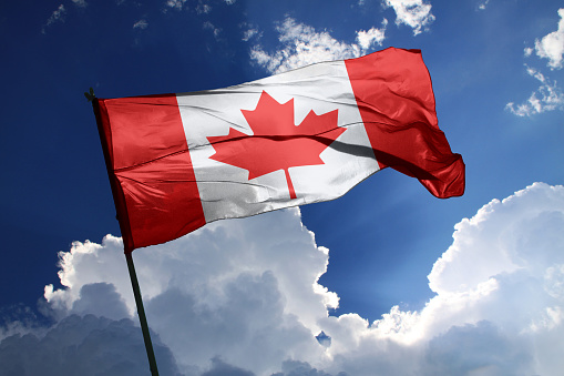 3d illustration flag of Canada. Canada flag isolated on the blue sky with clipping path.