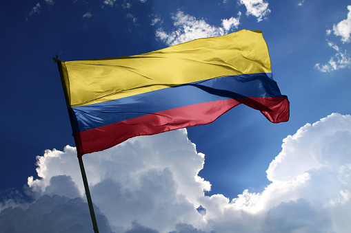 3d illustration flag of Colombia. Colombia flag isolated on the blue sky with clipping path.