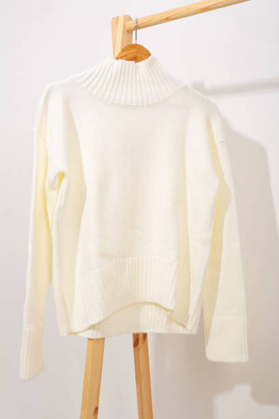 istock White wool sweater hanging on a hanger 1738963914