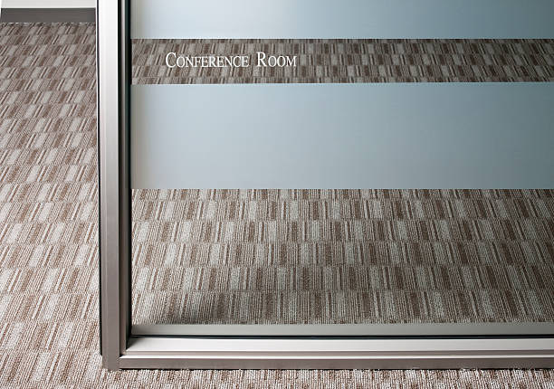 Conference Room Conference room with glass partition with etching.Other images forom the series. frosted glass door office stock pictures, royalty-free photos & images