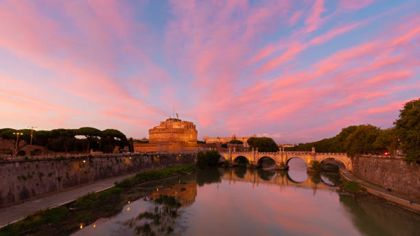 istock Ponte Sant'Angelo with Castel Sant'Angelo at sunset. Pink colors. beautiful sunset 1738965354
