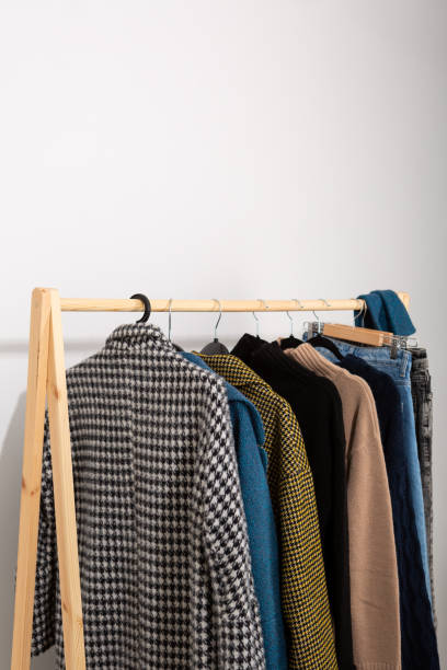 istock Woolen winter coats and clothes on hangers 1738966643