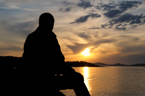 istock Silhouette of a man at sunset 173896759