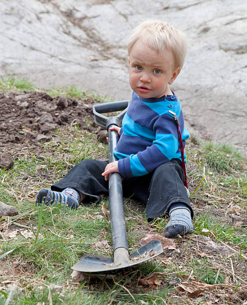 istock Toddler with big shovel. 173896794