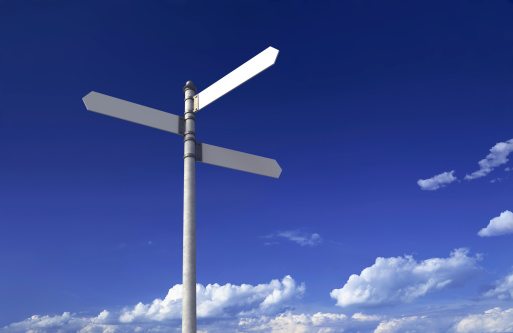 Blank signpost with three arrows over partly cloudy blue sky - just add your text.Precise clipping path included for easy background change.