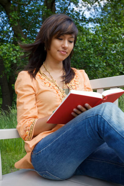 istock Reading a book outdoors 173896823