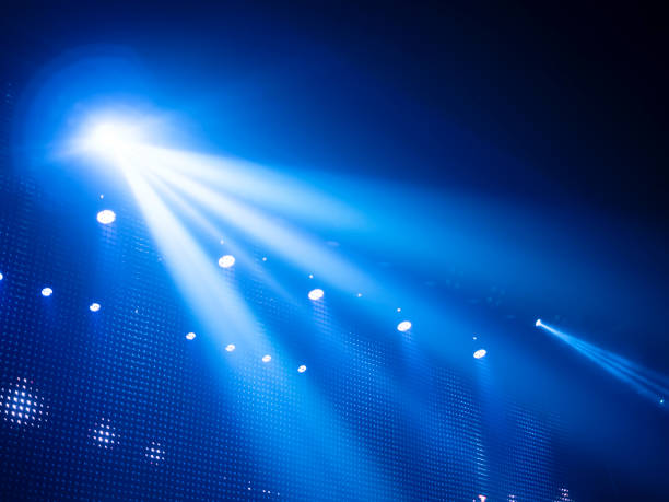 istock spotlights or light beams on-stage performance, concert, shining directly from left to right-hand side. for backdrop or background 1738968482