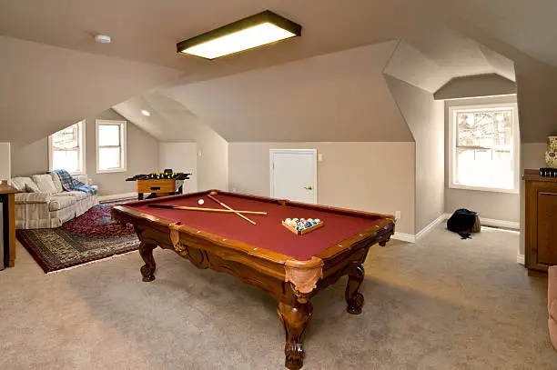 "This houses game room has a pooltable, hockey, and a relaxing area."