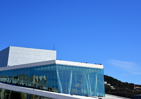 Oslo, Norway: Oslo opera house (Operahuset), located on the Bjørvika Bay waterfront - a two-part theater with opera and ballet, modeled on a floating iceberg, designed by the Norwegian architectural firm Snøhetta (“Snow Cap”), famous for the Biblotheca Alexandrina - with Christoph Kapeller as design leader and project director.