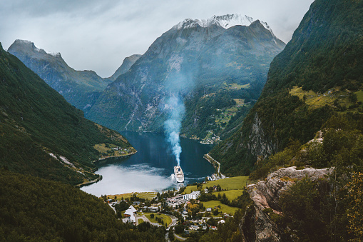 Geiranger fjord in Norway aerial view mountain landscape ferry cruise ship sailing Travel famous destinations norwegian landmarks