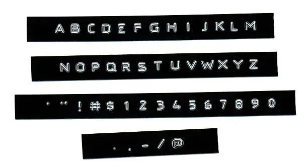 Photo of Embossed letters on black plastic tape