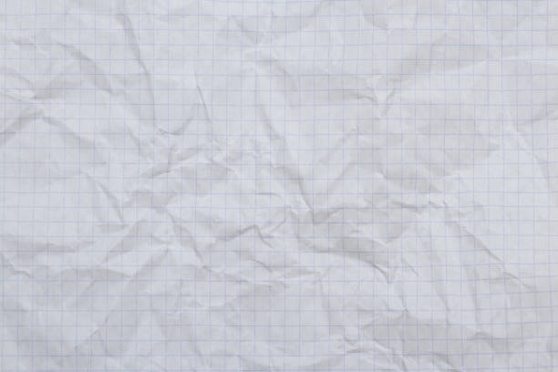 istock A crumpled sheet of checkered notebook paper. 1738976193