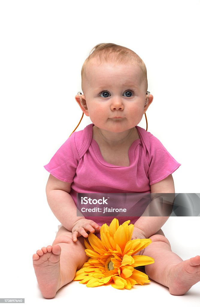 Jolie petite fille en rose fleur - Photo de Prothèse auditive libre de droits