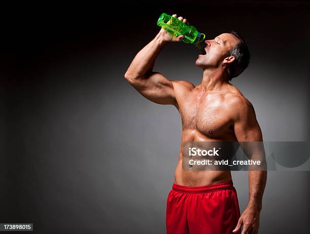 Fitness Athlete Drinking Water Stock Photo - Download Image Now - Muscular Build, Water Bottle, 30-39 Years