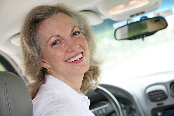 istock Smiling Senior Woman Inside Her Car 173898495