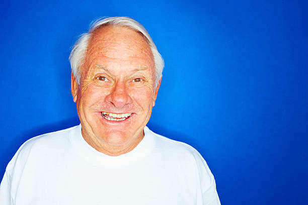 istock Elderly man isolated against blue background 173898647