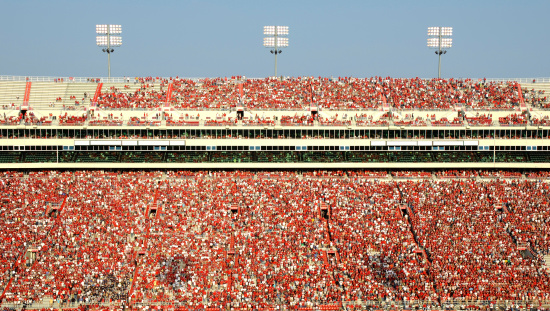 American football stadium full of spectators.