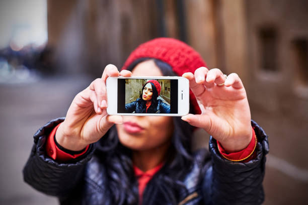 istock Young girl taking a selfie with her smartphone 1738996463