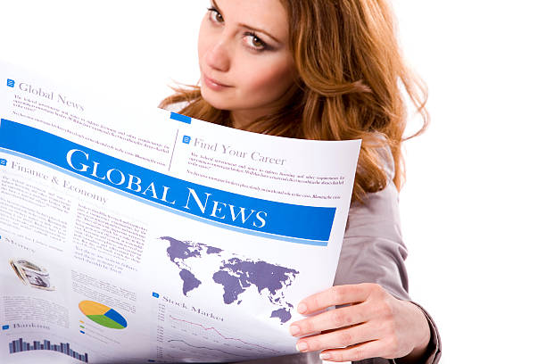 istock Businesswoman reading a newspaper 173899862