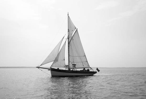 Sailing a Gaff Gaff sailing yacht in calm water. gaff sails stock pictures, royalty-free photos & images