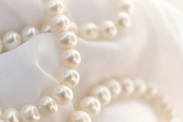 istock A poetic arrangement of pearls lays on a soft canvas, the blurring effect adding a touch of mystery. The scene encourages a slow, thoughtful appreciation in a fast-scrolling digital world. 1739000990