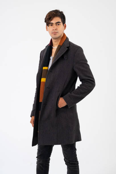 istock Confident African man in a studio wearing a scarf and jacket 1739003755