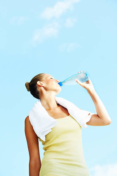istock Young woman drinking water 173900438