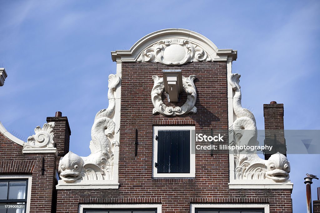 Ornato tetti a capanna degli casa di Amsterdam - Foto stock royalty-free di Amsterdam