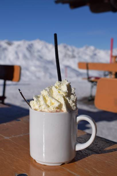 istock Fresh whipped cream and hot chocolate on snowy mountain 1739005392