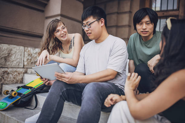 istock Friends sitting on steps together 1739005427