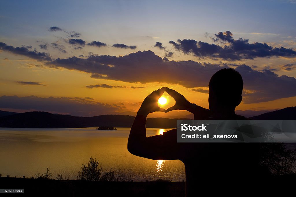 Tramonto In una mano - Foto stock royalty-free di Acqua