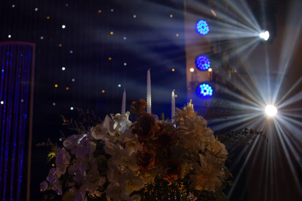 Wedding candles, flower decorations, lighting up during the night.