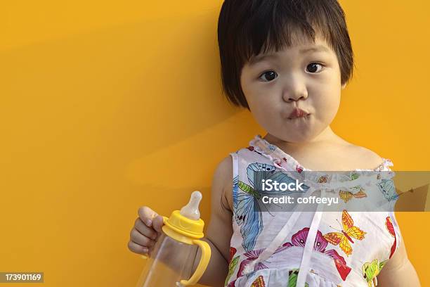Asian Baby Holding A Bottle Stock Photo - Download Image Now - 18-23 Months, Asian and Indian Ethnicities, Baby - Human Age