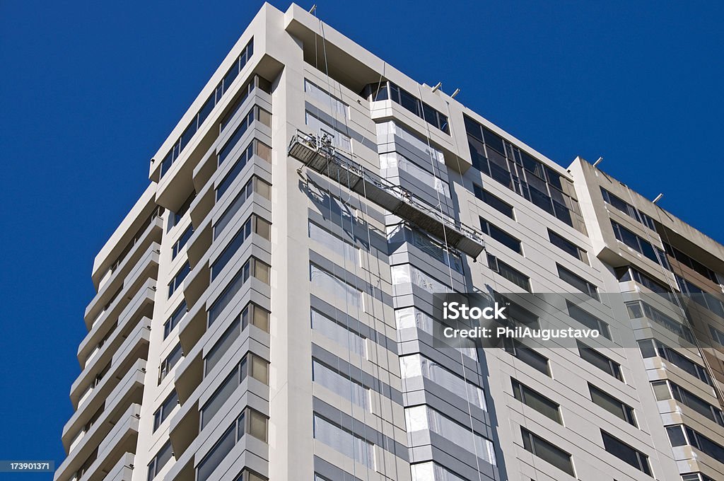 Men painting condominium Building Exterior Stock Photo