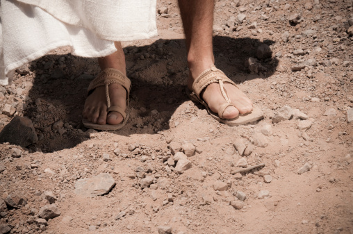 A man wearing old sandals and robe. Similar images: