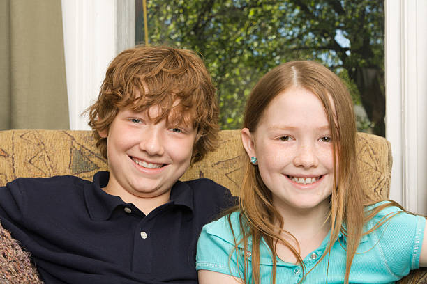 Subject: Portrait of brother and sister in their home.