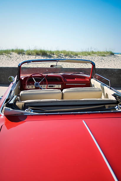 istock Red 60's convertible at the beach 173901941