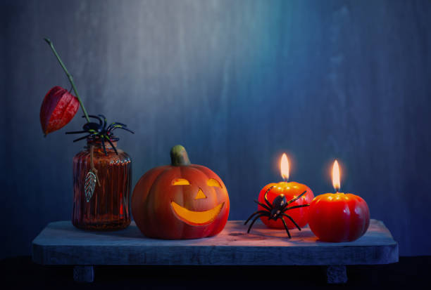 istock halloween decorations with pumpkin on dark wooden background 1739020068