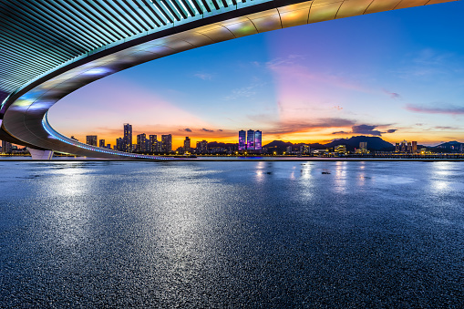 Road platform and skyline with sky clouds at sunset