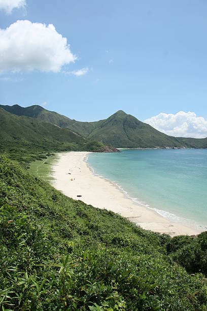 istock Long white beach nestled in the mountains 173902551