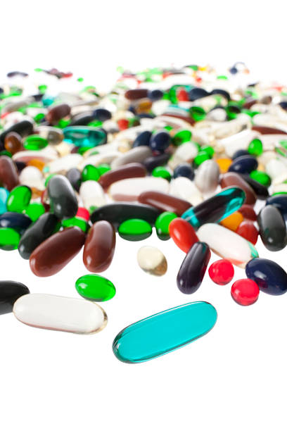 cápsulas de complemento alimentar. - gel effect capsule pill vitamin e - fotografias e filmes do acervo