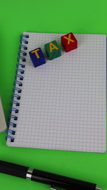 Tax written on colorful wooden cubes