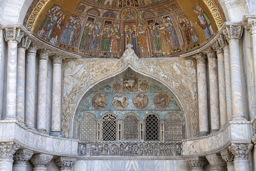 Venice, Italy - September 27, 2023: St Mark's Basilica (Basilica di San Marco), mosaic on facade. Roman Catholic church in Romanesque Byzantine architectural style located on St Mark's Square (Piazza San Marco)