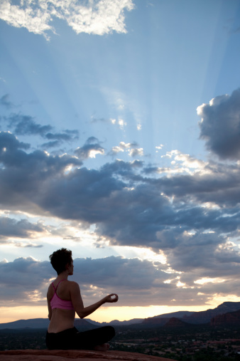 Woman in yoga pose at sunset Sedona Arizona