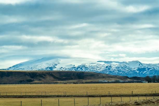 istock the mountain range stands out among two brown fields and grass 1739034625