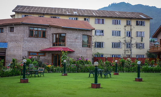 Srinagar, India - Jul 2, 2015. Old villas with flower garden in Srinagar, India. Srinagar is the summer capital of the Indian state of Jammu and Kashmir.