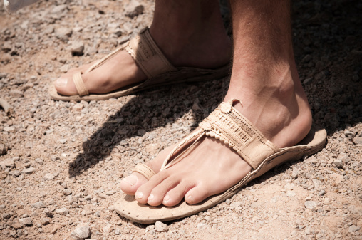 A man wearing old sandals and robe. Similar images: