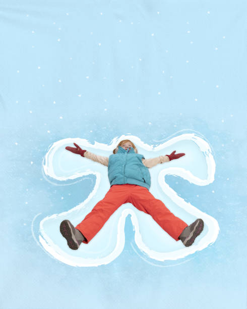 Snow angel design made in fresh, deep snow, by lying on back and moving arms up and down, and legs from side to side in winter